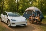 White electric car parked next to a family camping outdoors with a tent.