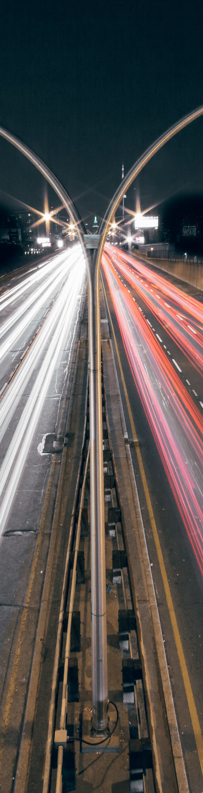 Timelapse image of car lights on a highway 